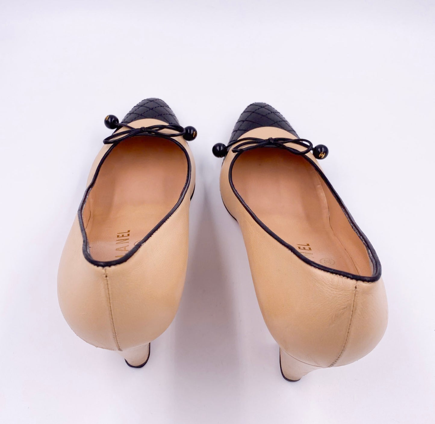 Chanel Beige Pump with Black Quilted Toe