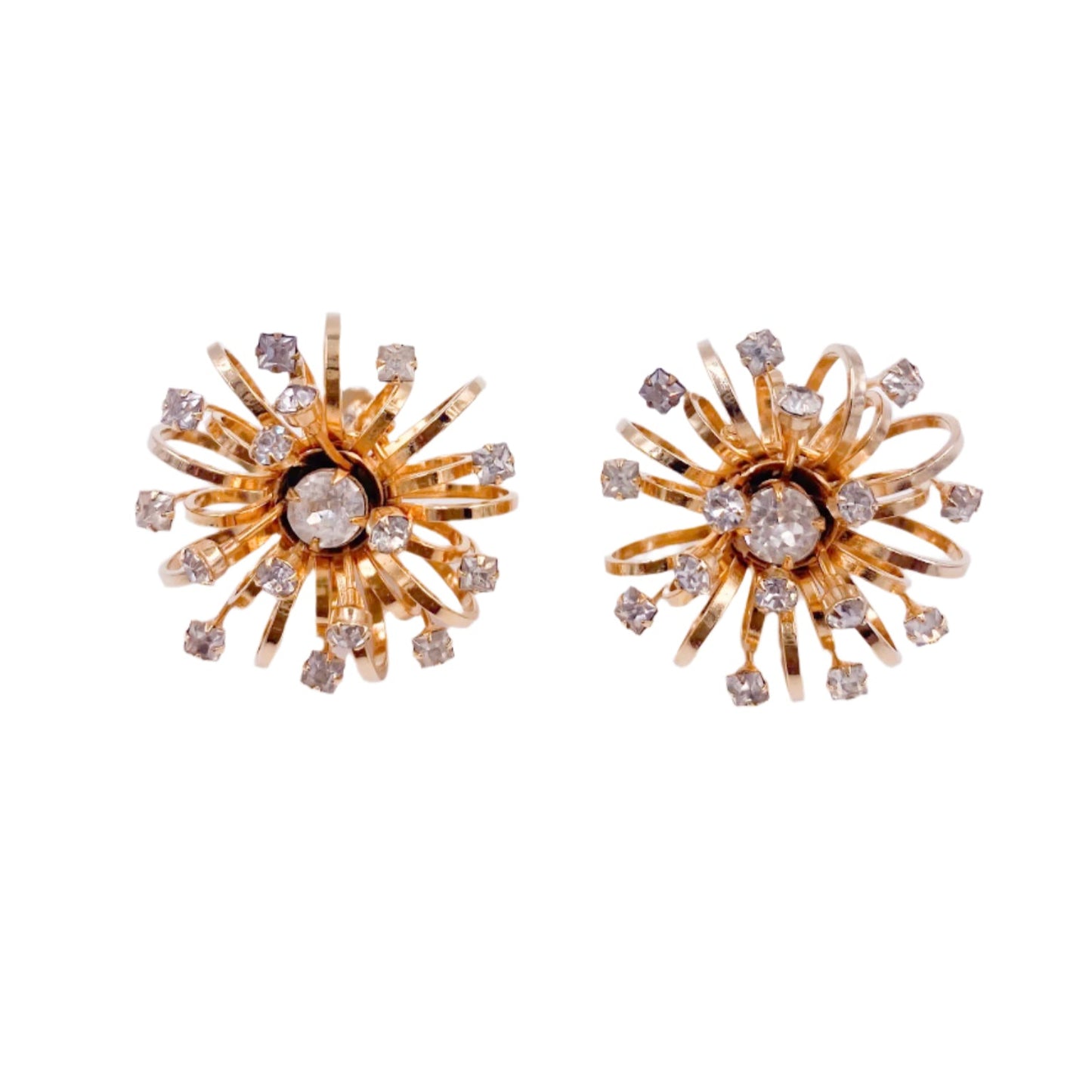 Gold sunburst earrings with clear stones on a white background