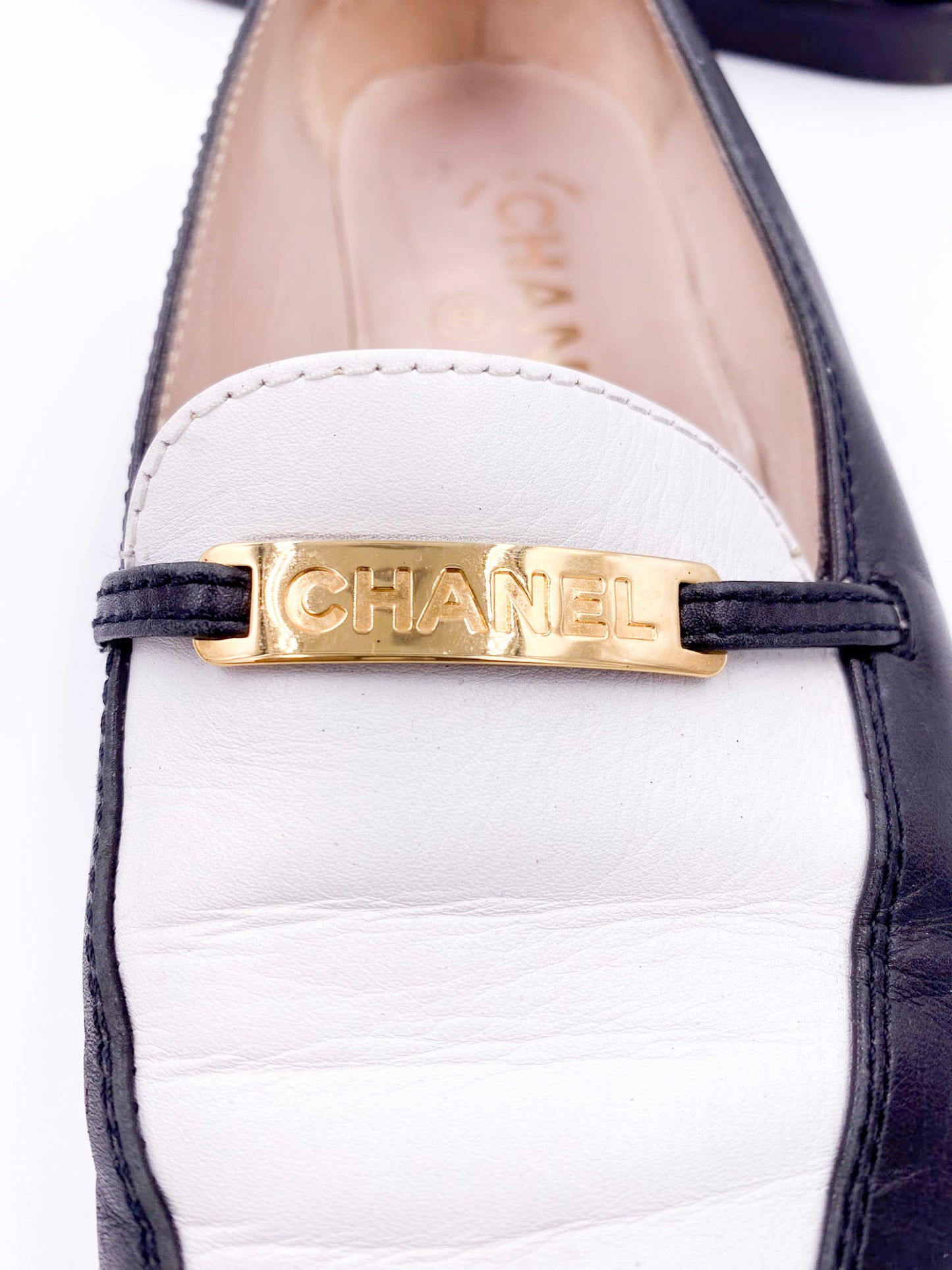 Chanel Black/White Loafers with Gold Emblem