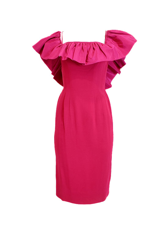 Pink dress with ruffled shoulders on a white background