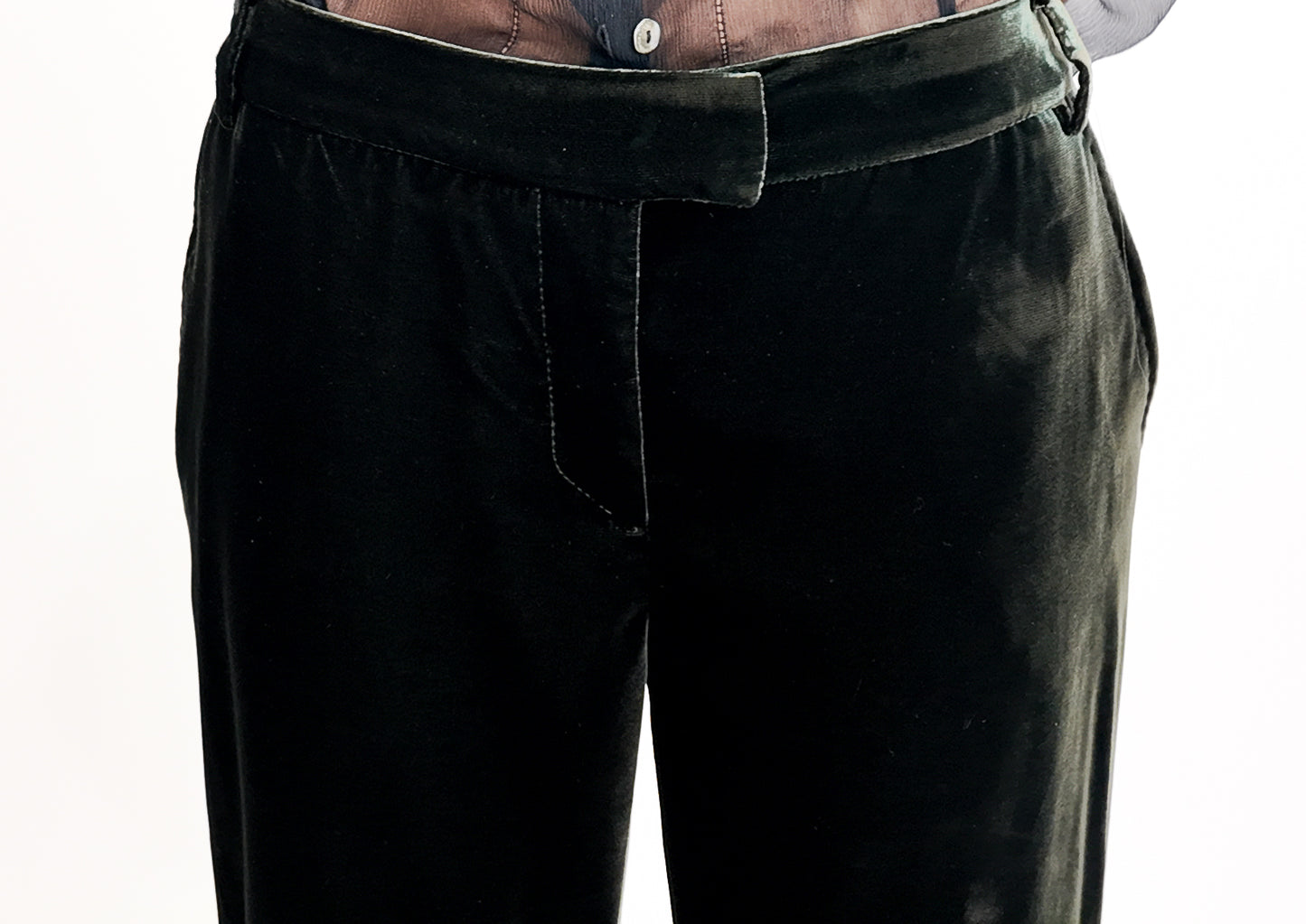 Green velvet pants on a white background