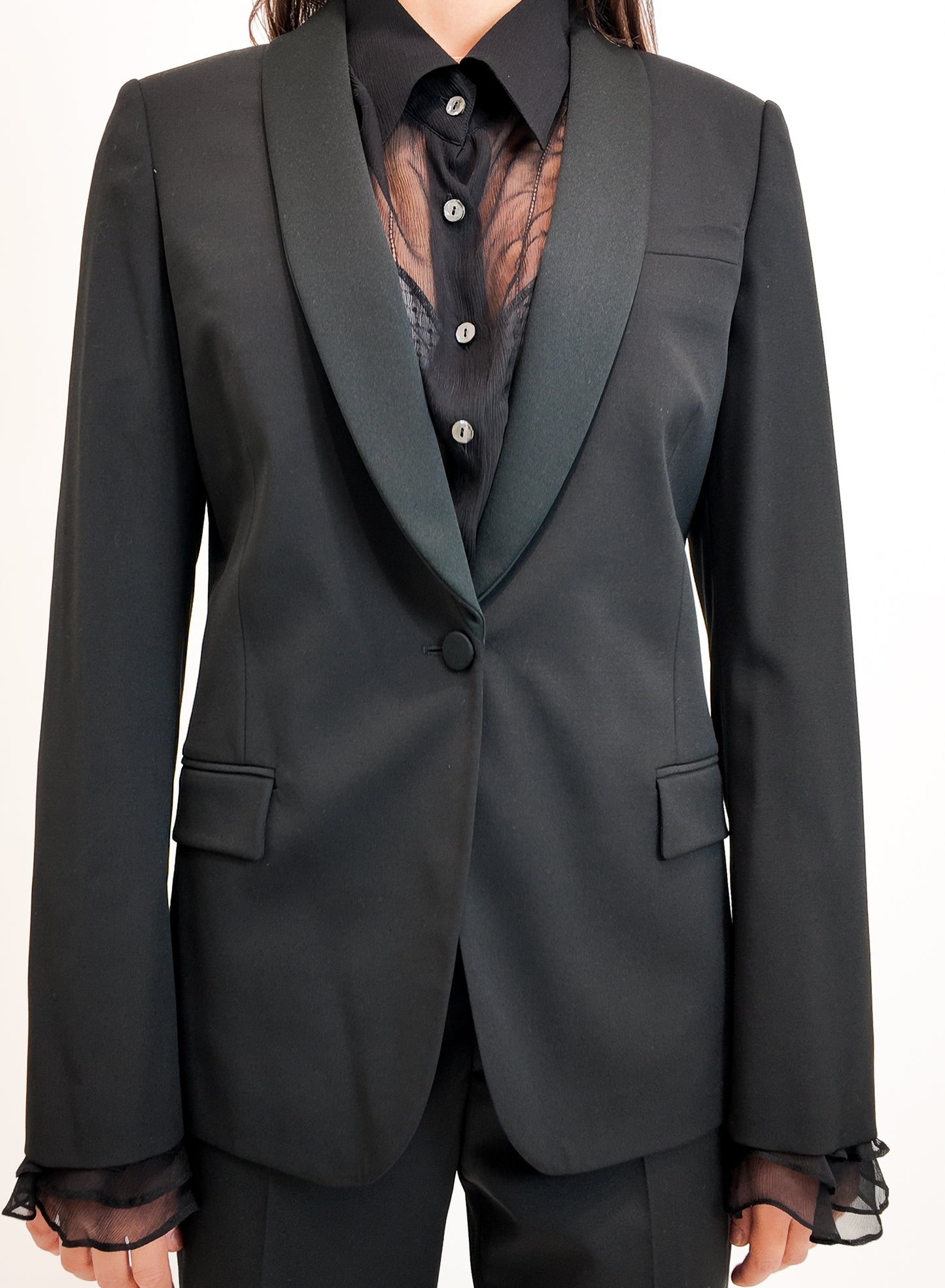 Black tuxedo jacket with a white background