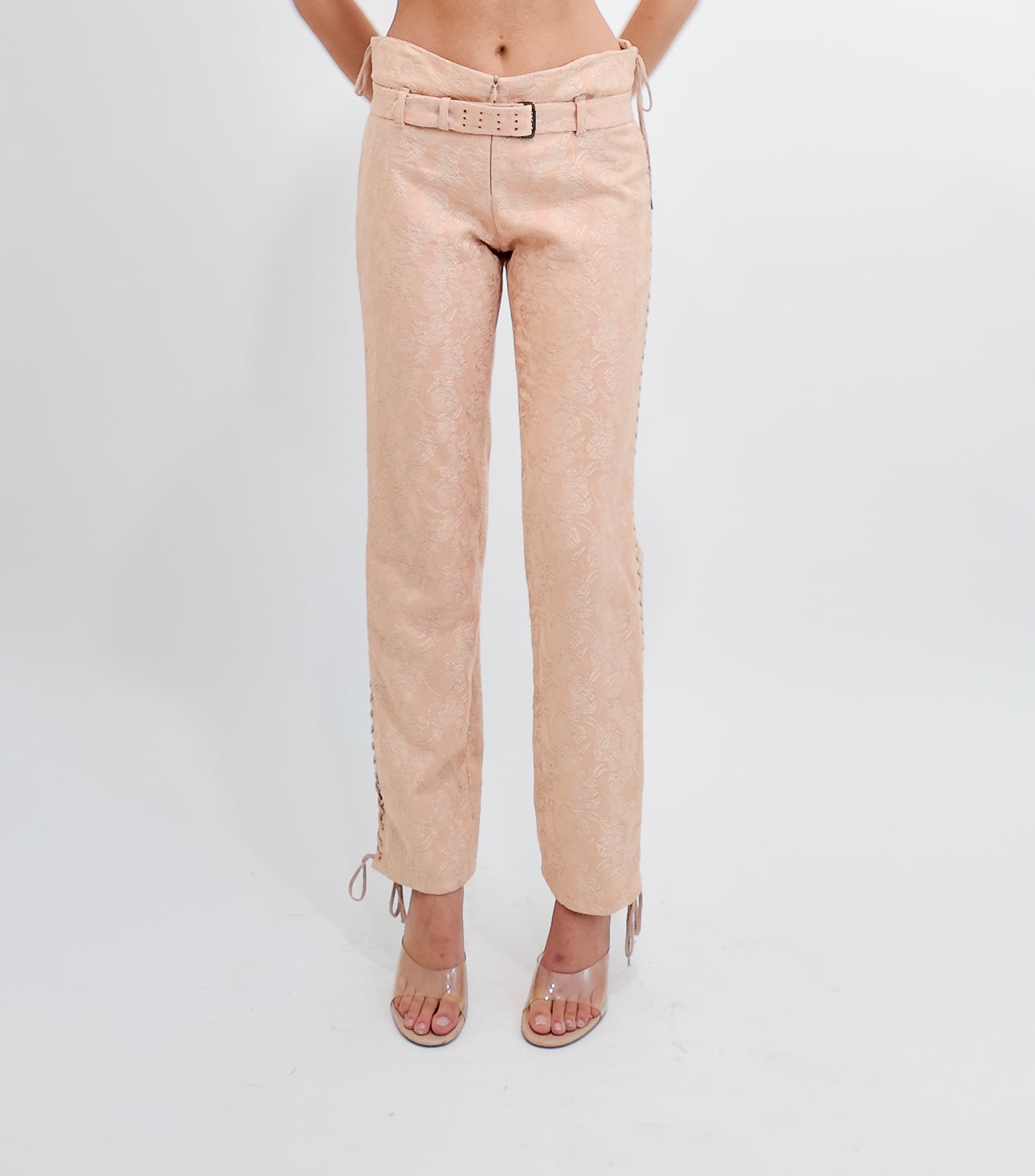 Nude pants worn by a person on a white background