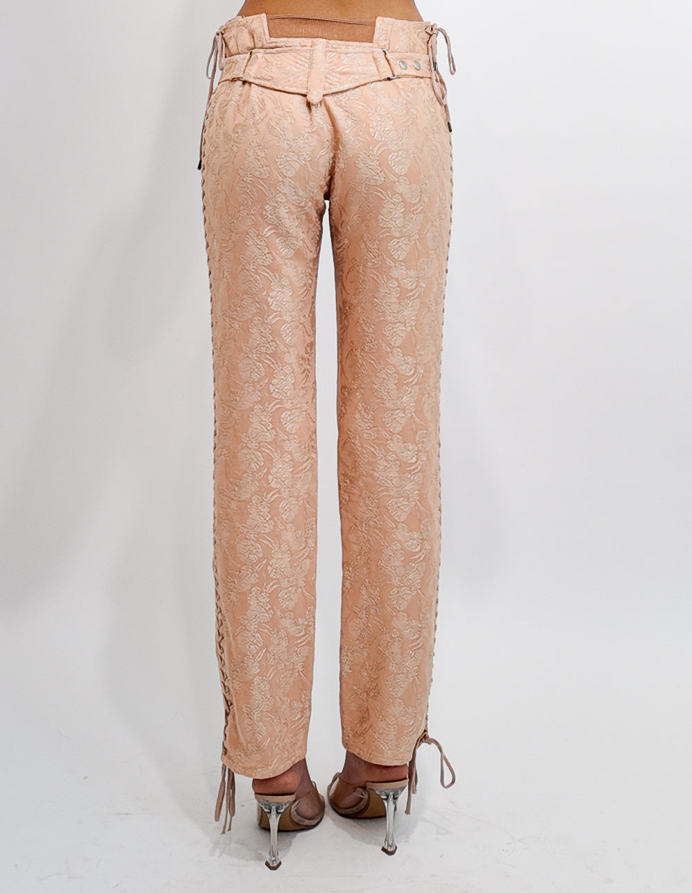 Nude brocade  pants worn by a person on a white background