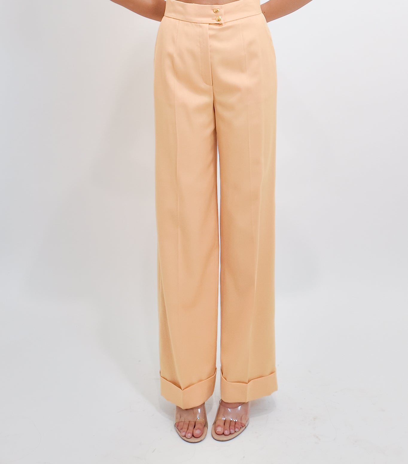 Peach wide-leg pants on a white background