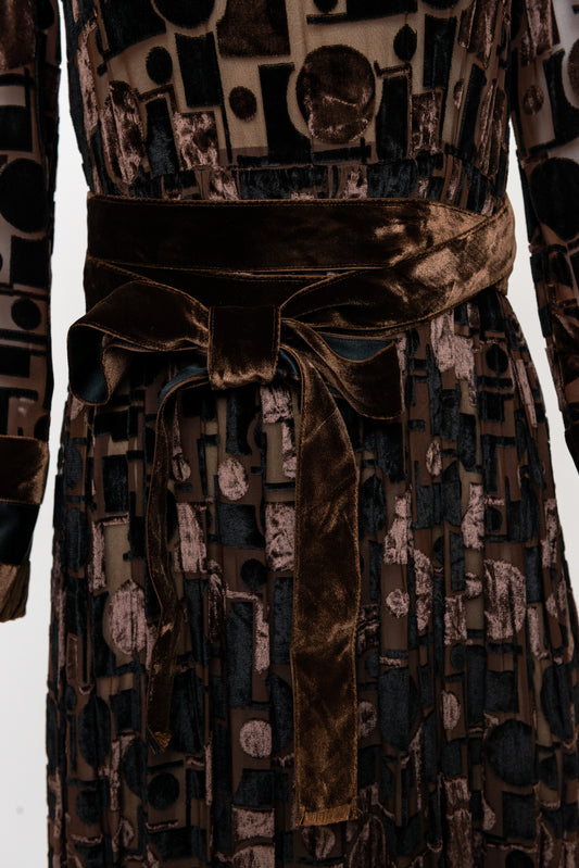 Patterned dress with a belt on a white background