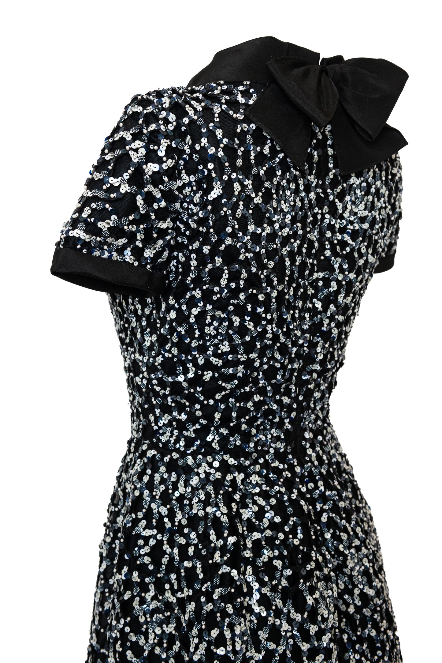 Up close of black sequin dress with bow tie