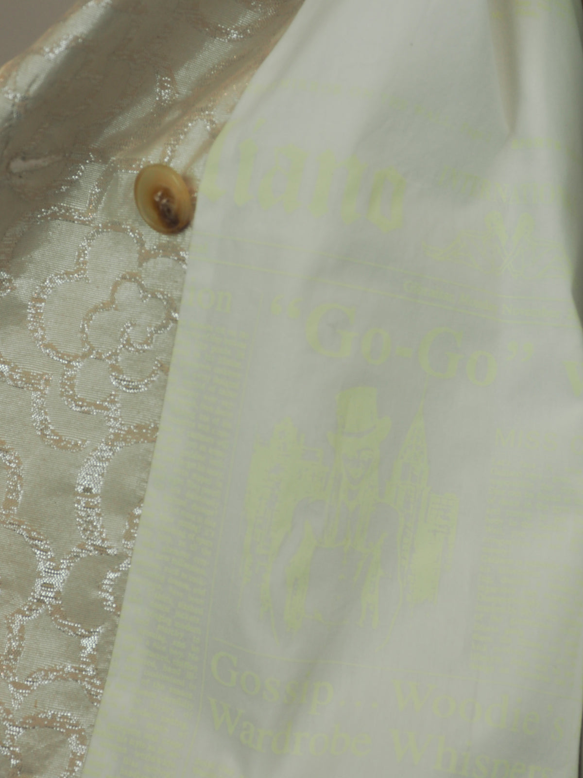 A vintage John galliano 2010 cropped double-breasted jacket in a white light beige jacquard fabric with a subtle floral pattern, featuring notched lapels and four brown buttons