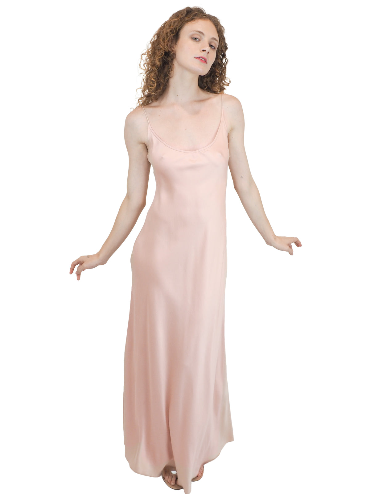 A vintage bridal pale pink satin silk slip dress with spaghetti straps