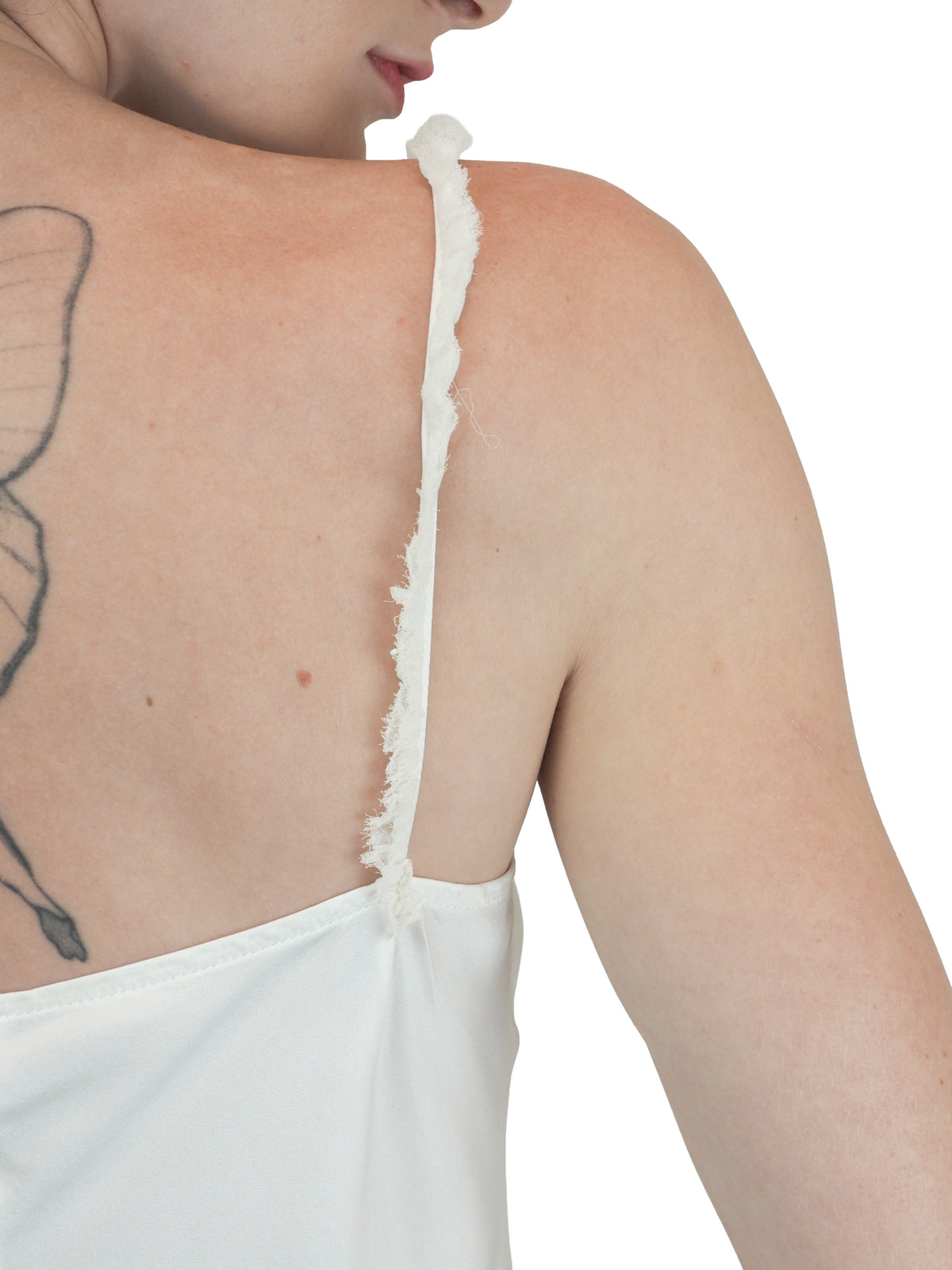 A vintage bridal mini white satin silk slip dress with spaghetti straps
