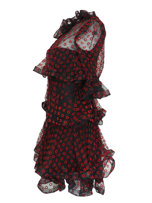 A vintage Arnold Scaasi designer black sheer mesh dress with a red and black poppy print, featuring a ruffled high neck, long puff sleeves, and a tiered ruffled skirt