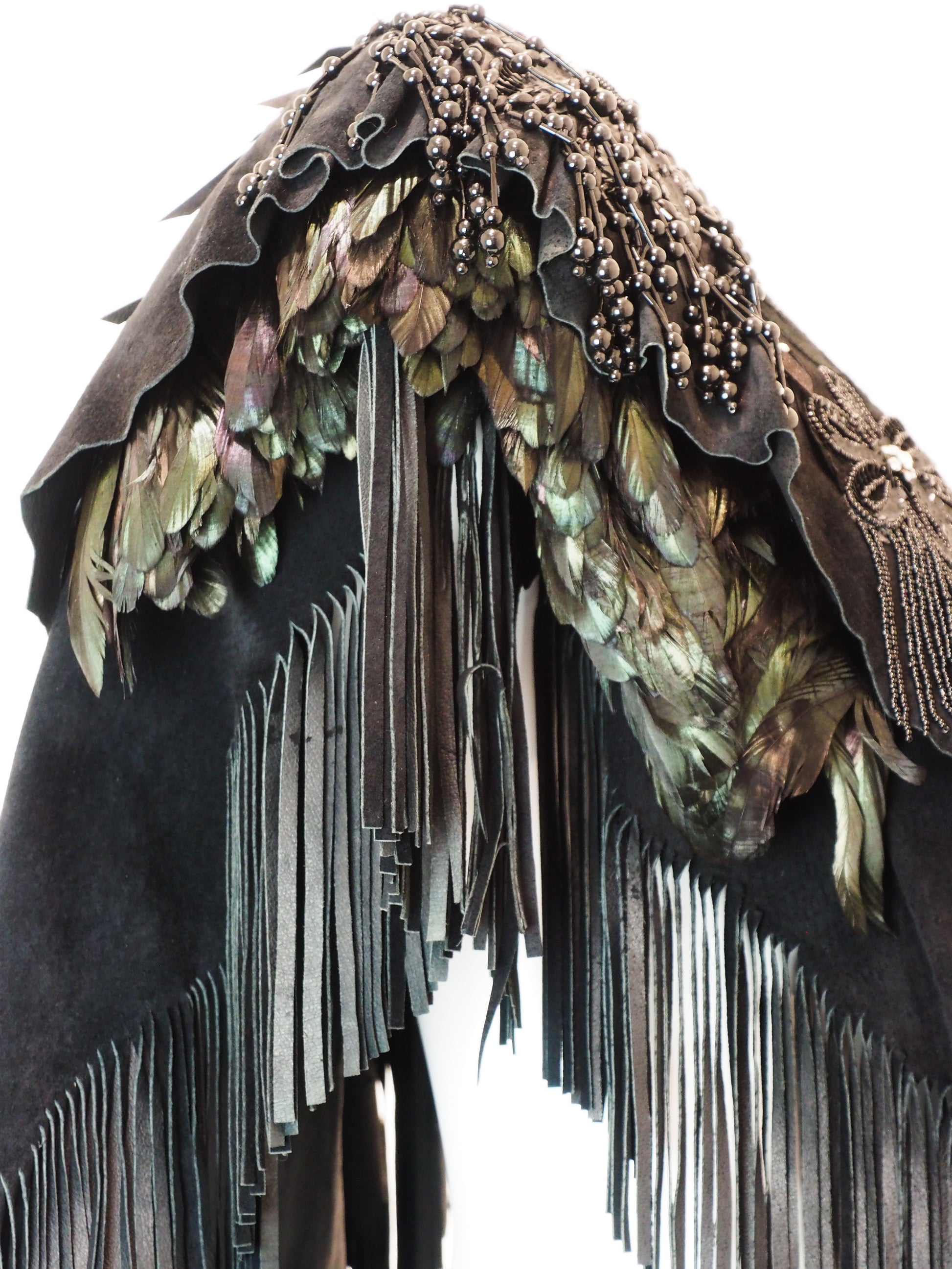 Feathered headdress with fringes on a white background