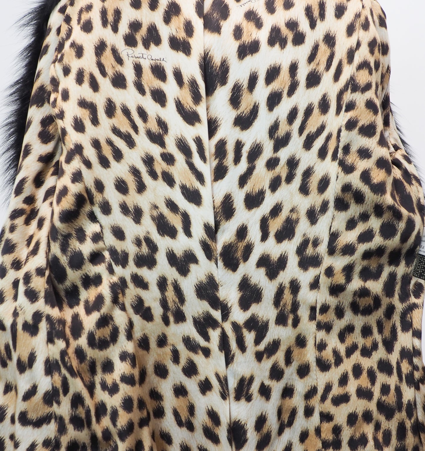 Close-up of a leopard print fabric with a visible brand label.