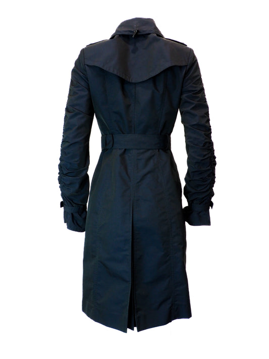 Black belted trench coat on a white background