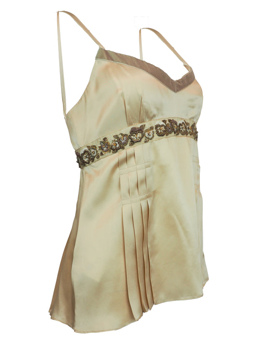 A vintage John galliano Y2K light beige satin camisole top with a V-neckline, thin shoulder straps, a decorative floral embroidered waistband, and pleated detailing on the front