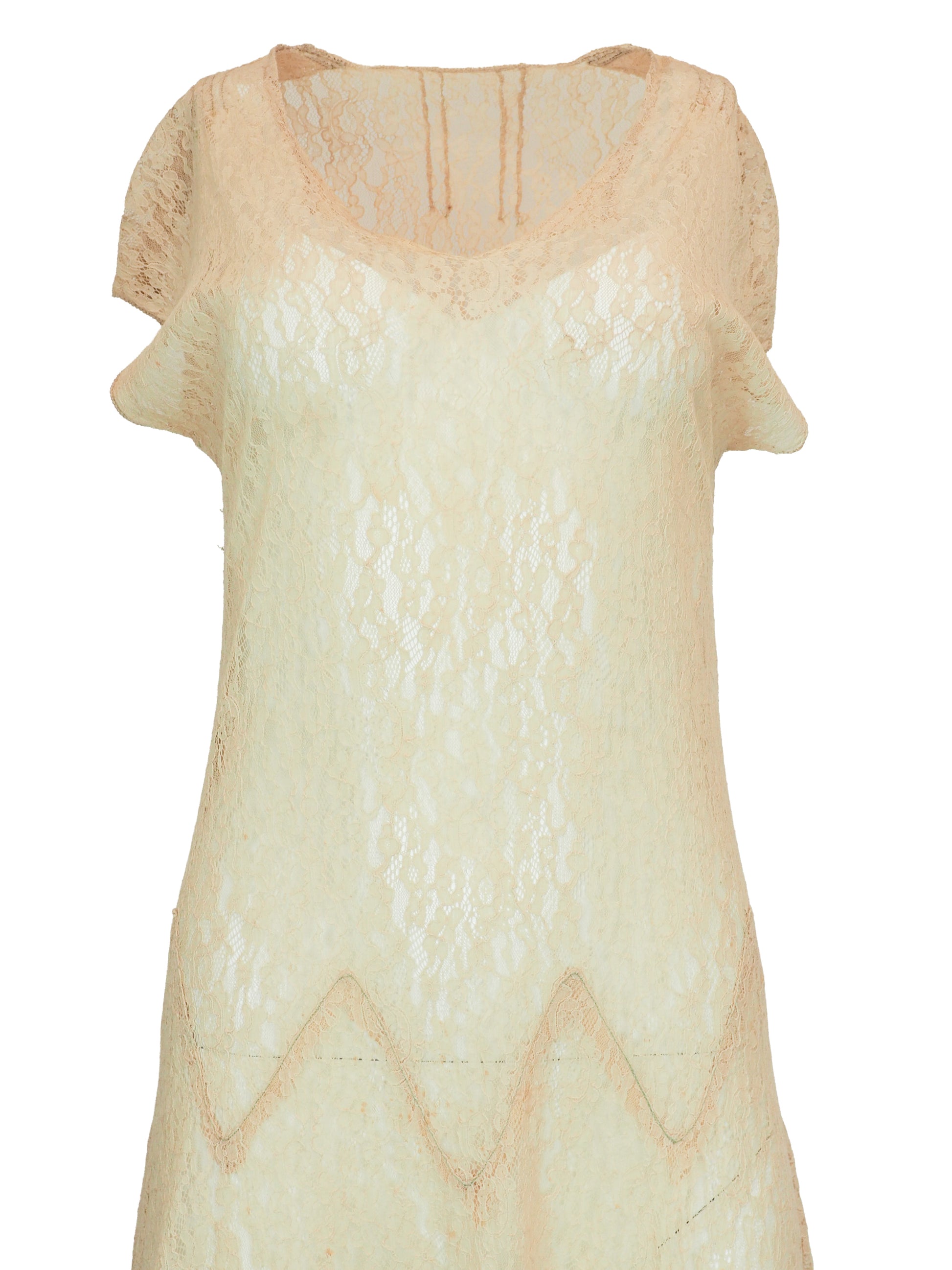 A vintage 1920s light beige lace maxi dress with short flutter sleeves, a scoop neckline, and a scalloped zigzag pattern around the waist