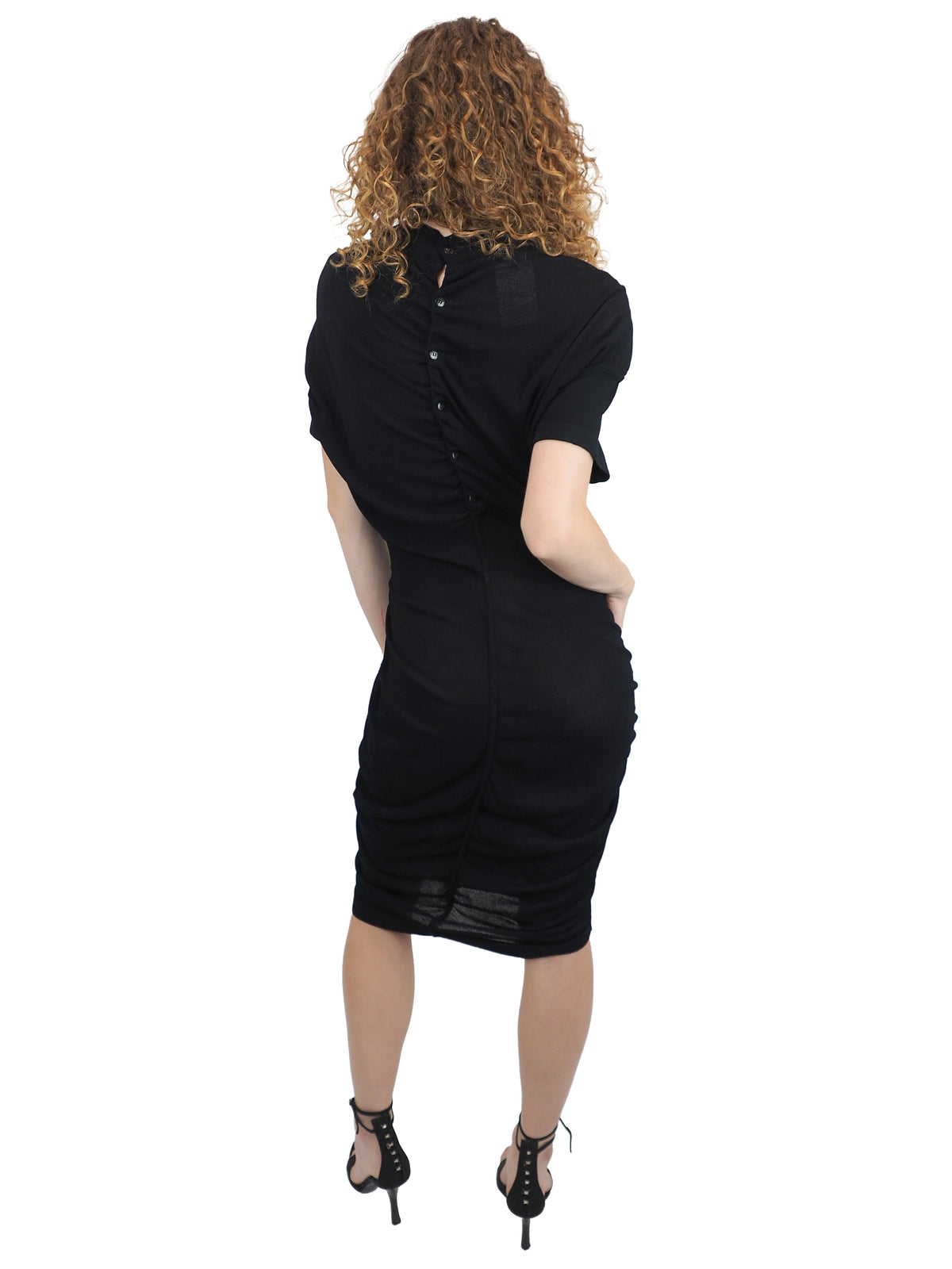 A vintage 1990s alaia black short-sleeve bodycon knit dress with back button details