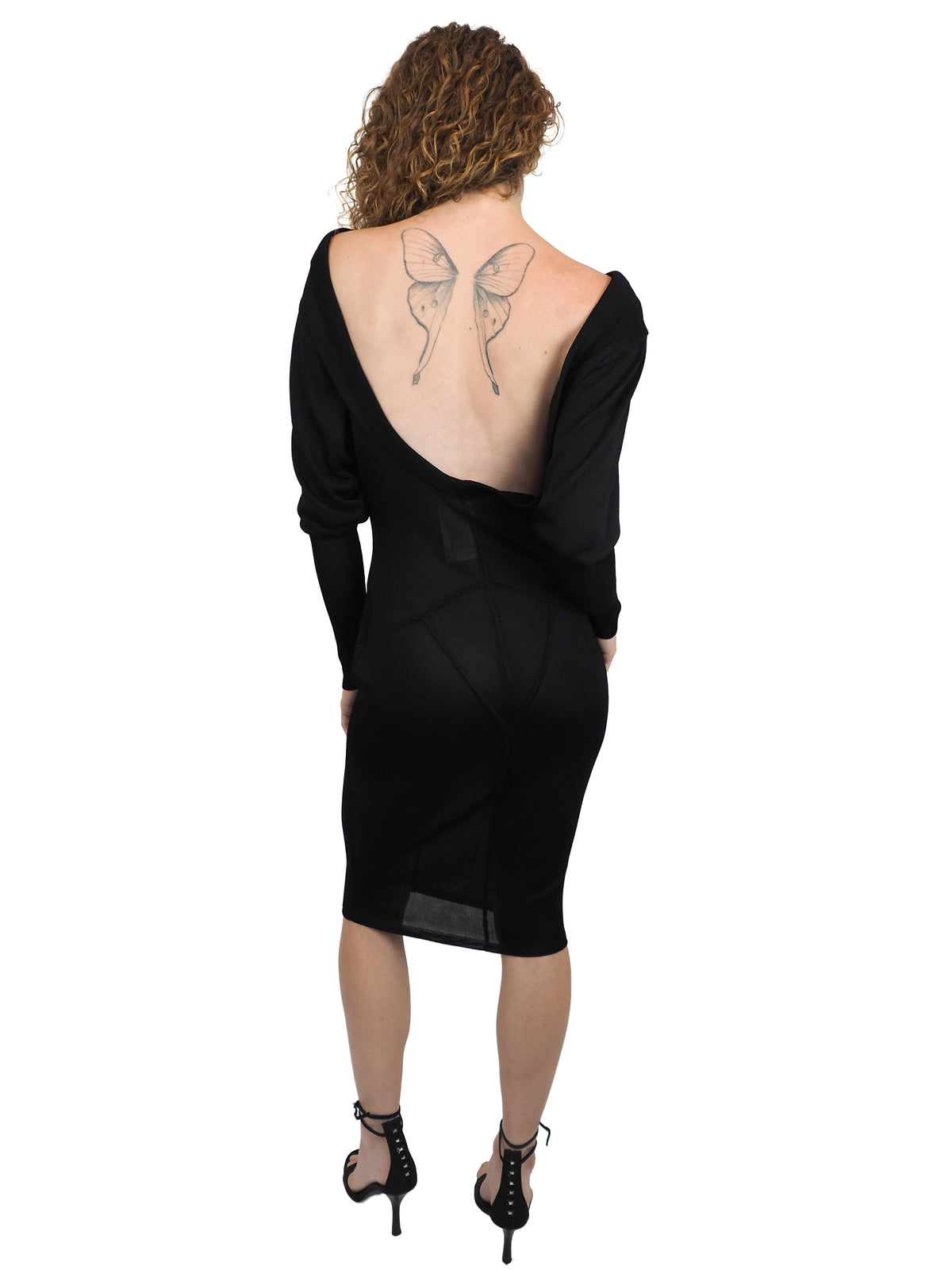A vintage 1990s alaia black long-sleeve bodycon knit dress with a boat neckline open back detail