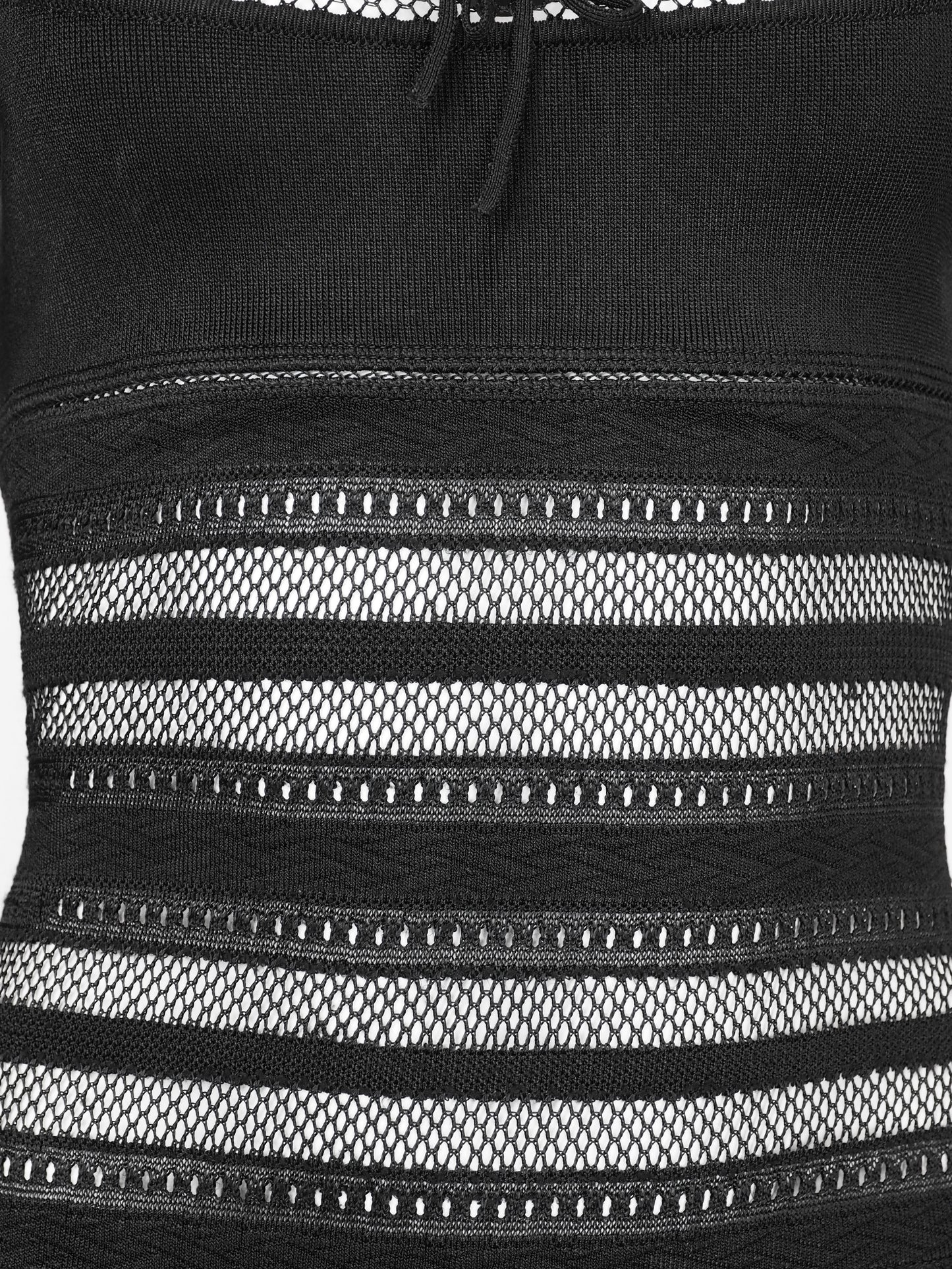 A vintage alaia 1993 black long-sleeve knit mini dress with horizontal openwork stripe patterns across the bodice, sleeves, and hem, featuring a scoop neckline with a front tie detail.