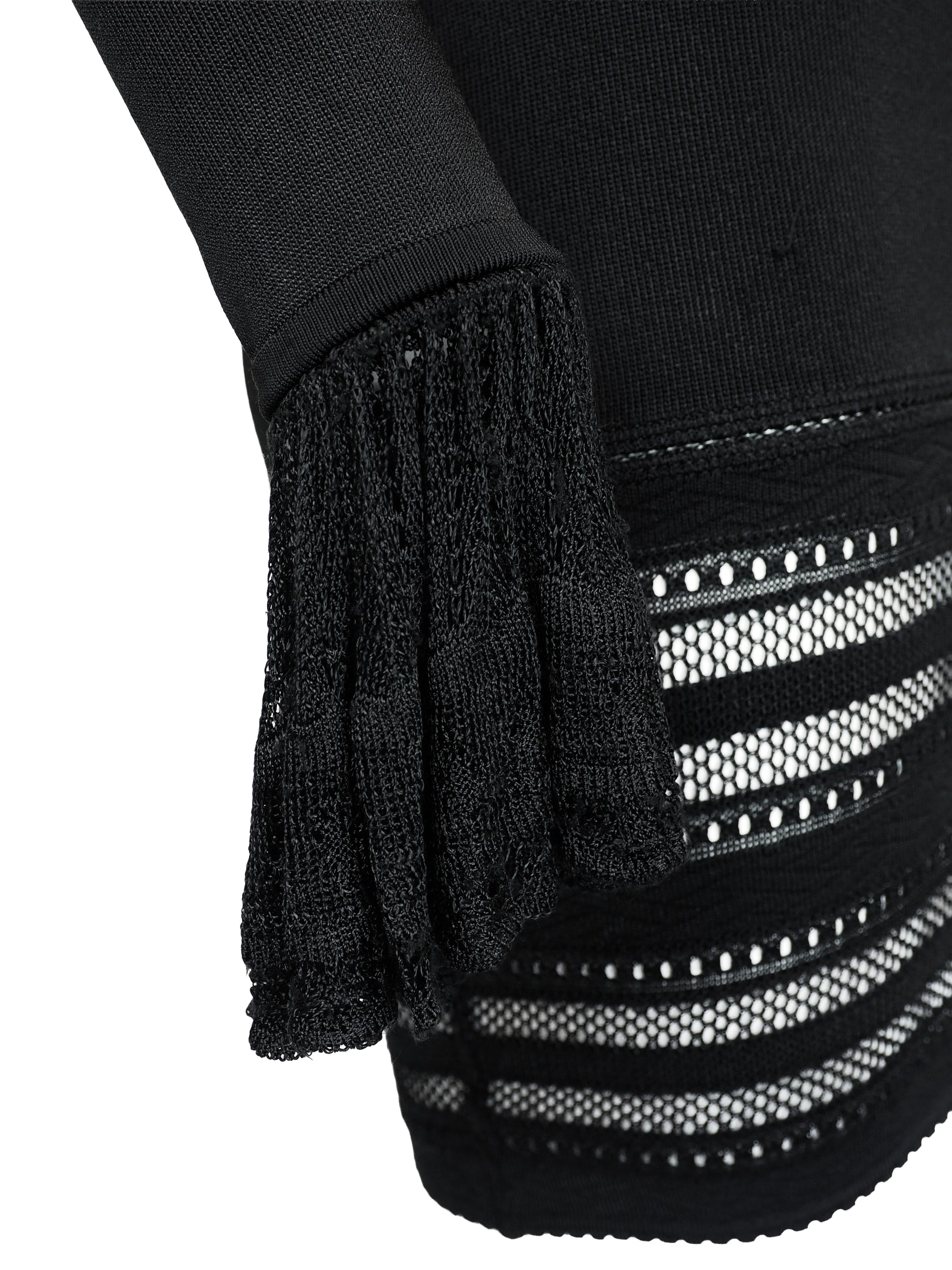 A vintage alaia 1993 black long-sleeve knit mini dress with horizontal openwork stripe patterns across the bodice, sleeves, and hem, featuring a scoop neckline with a front tie detail.