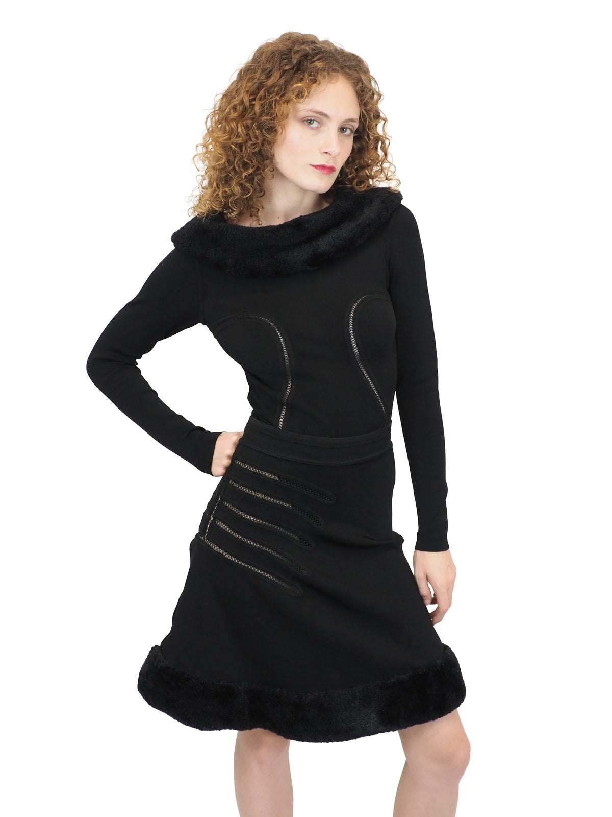 A vintage 1991 alaia black long-sleeve top and skirt set with a fuzzy collar and hem, featuring cut out seam curved trim details on the bodice and skirt