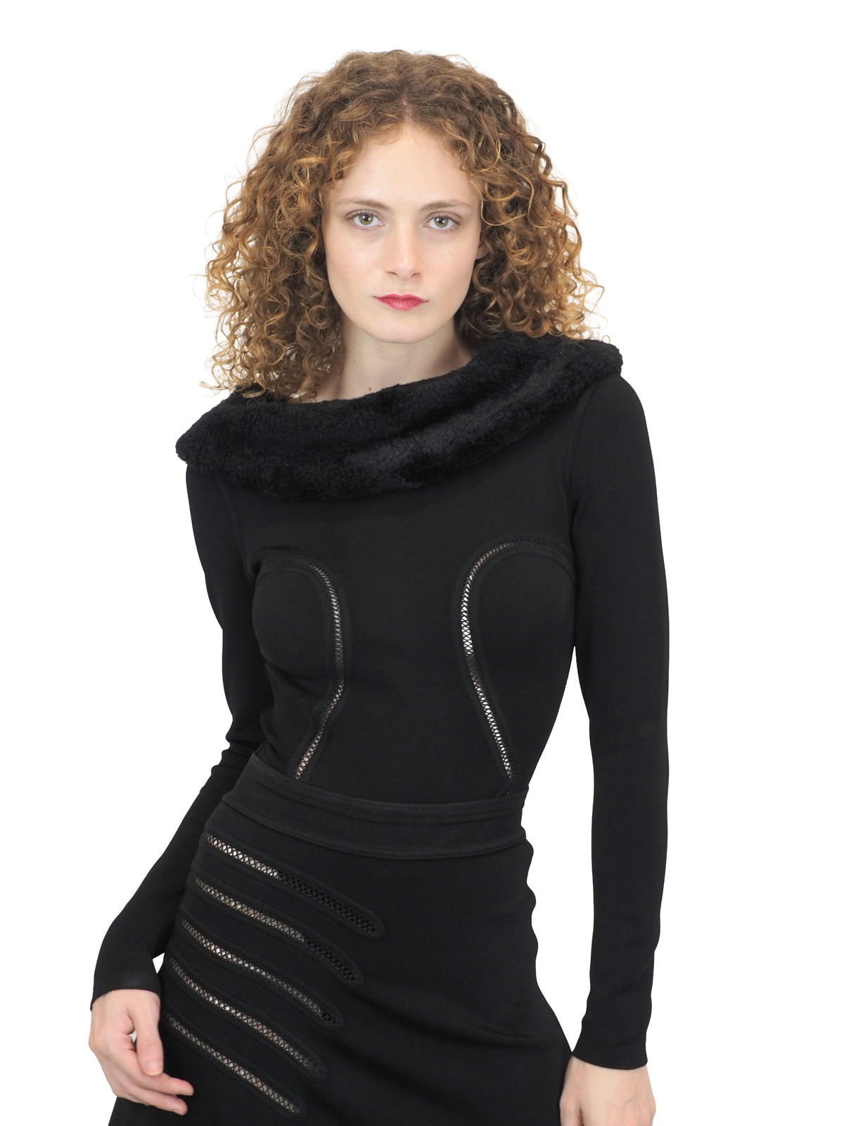 A vintage 1991 alaia black long-sleeve top and skirt set with a fuzzy collar and hem, featuring cut out seam curved trim details on the bodice and skirt