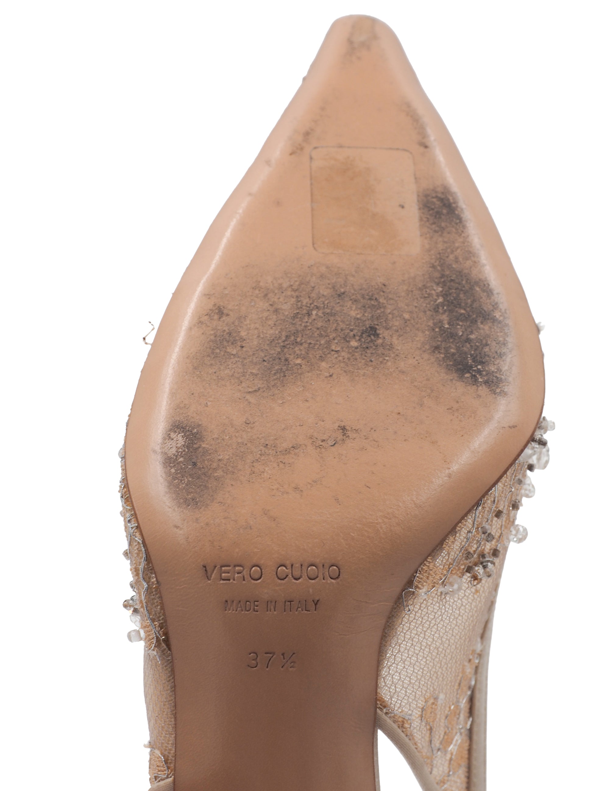 A vintage pair of Badgley Mischka pointed-toe slingback heels in sheer nude lace with dense crystal embellishments, shown on a plain white background.
