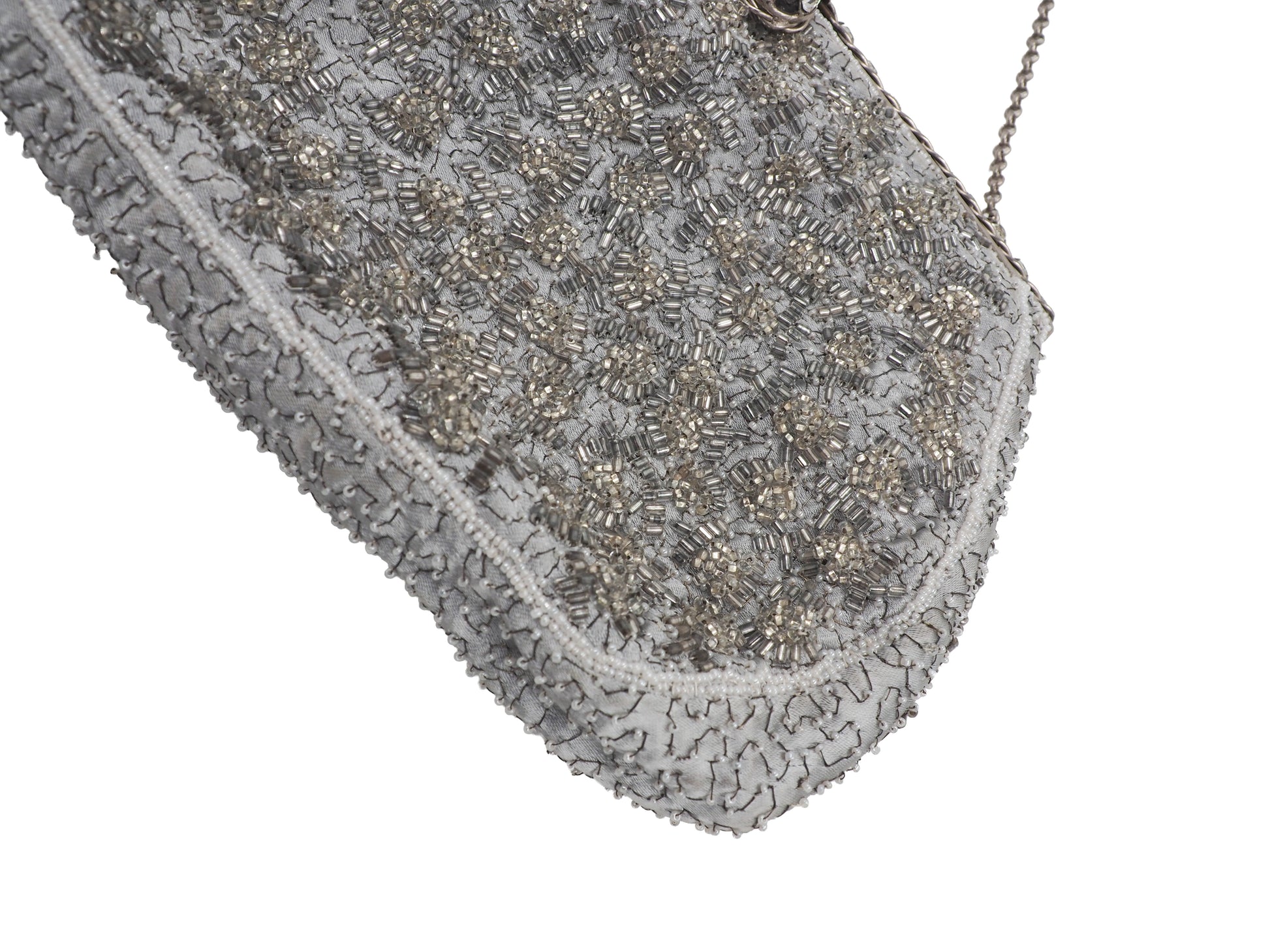 A vintage Elizabeth Arden silver-gray beaded evening clutch bag with a chain strap and a decorative crystal-embellished clasp