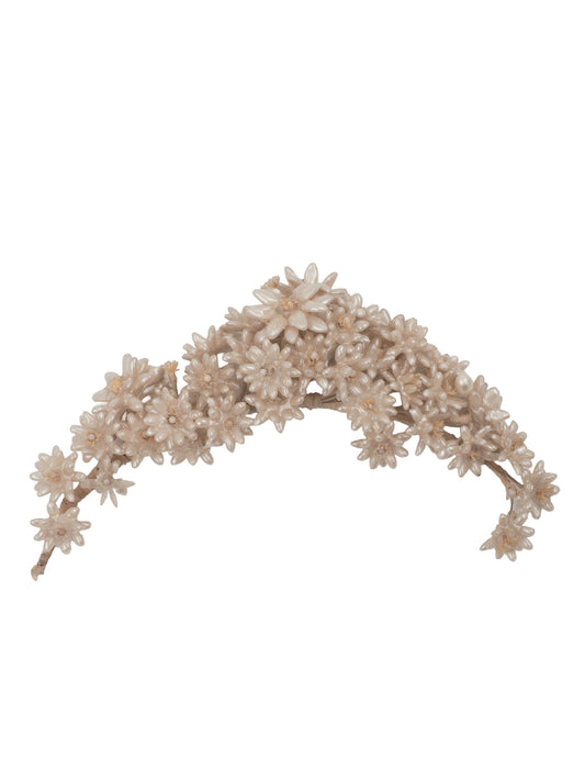 A vintage wedding delicate floral headband featuring small cream-colored faux flowers and branches