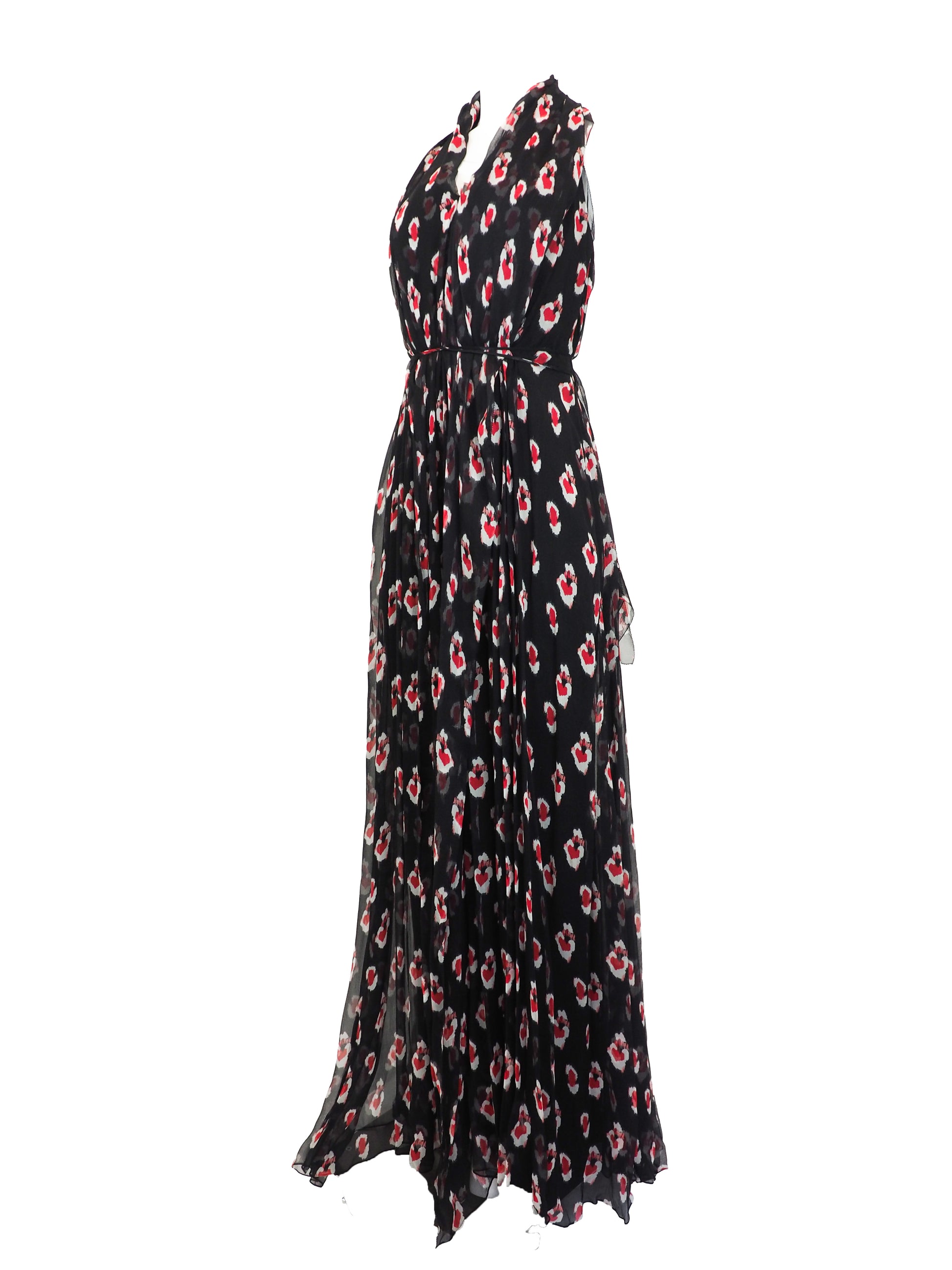 A vintage Carolina Herrera chiffon sleeveless black maxi dress with a red and pink floral print, featuring a halter-style neckline and a tie-waist detail, shown against a plain white background.