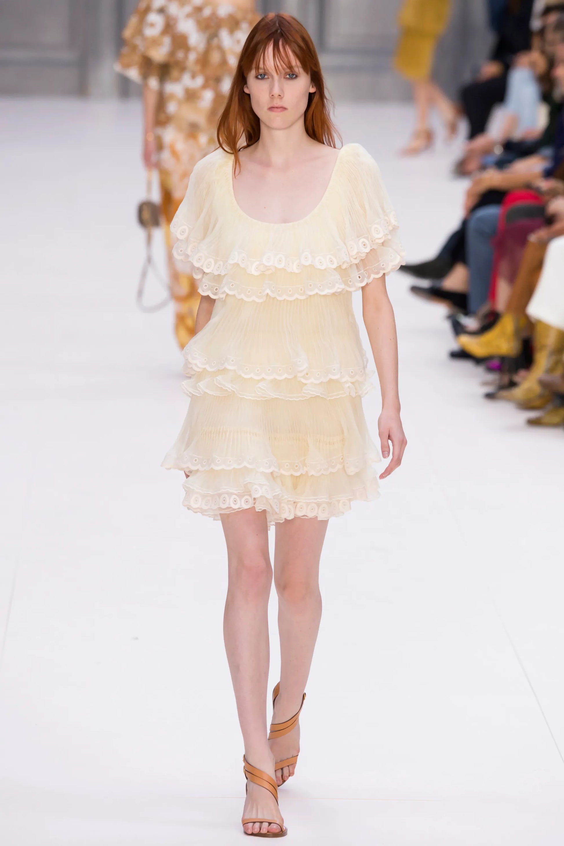 A vintage Chloe runway cream-colored tiered lace dress with ruffled eyelet trim and off-the-shoulder sleeves