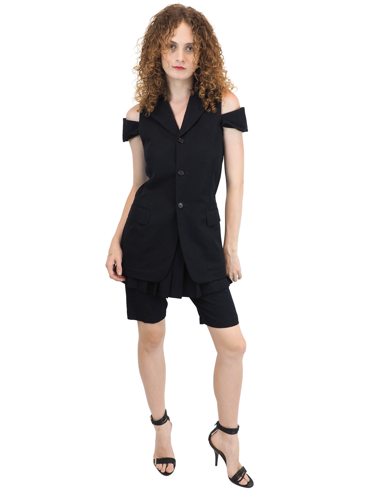 A vintage comme des garçons cold-shoulder blazer with matching navy shorts