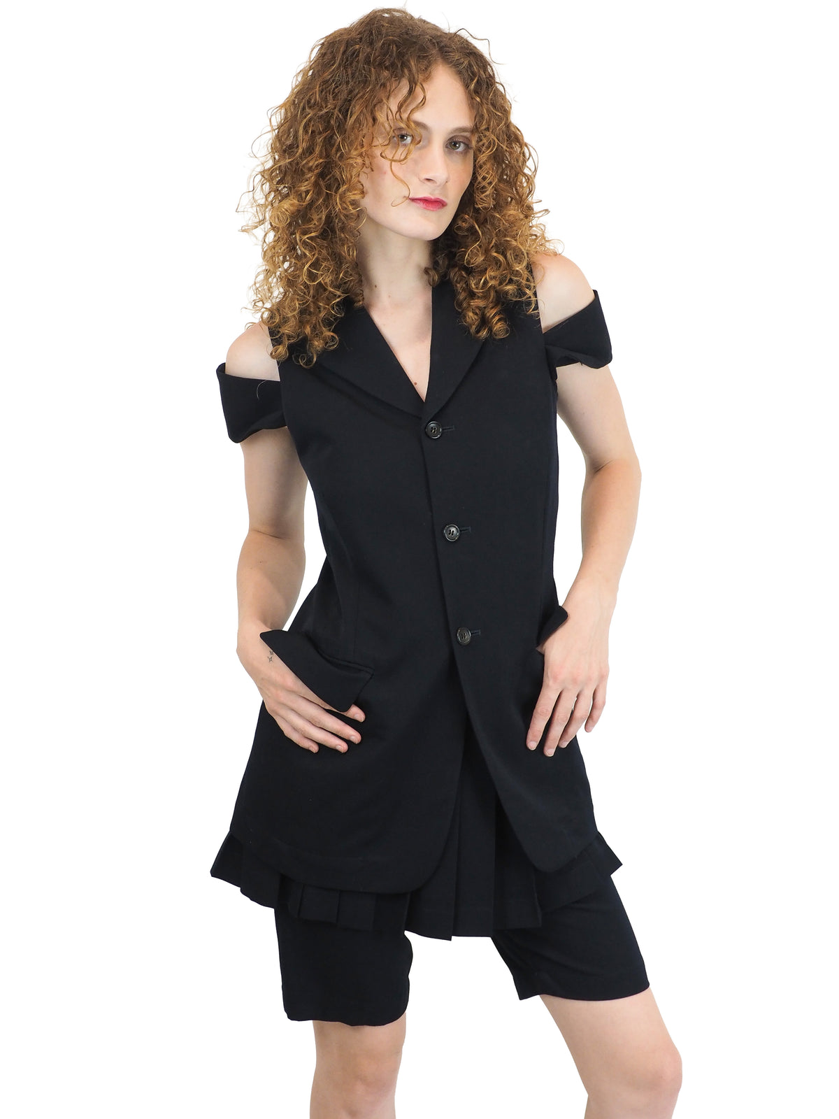 A vintage comme des garçons cold-shoulder blazer with matching navy shorts