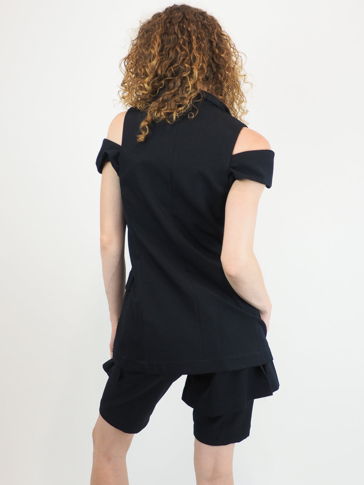 A vintage comme des garçons cold-shoulder blazer with matching navy shorts