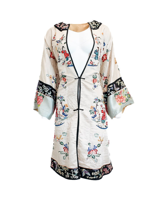 Embroidered kimono-style jacket on a white background