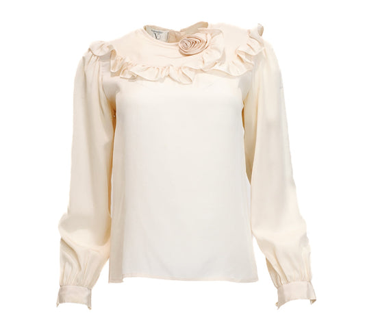 Cream-colored blouse with floral details on a white background