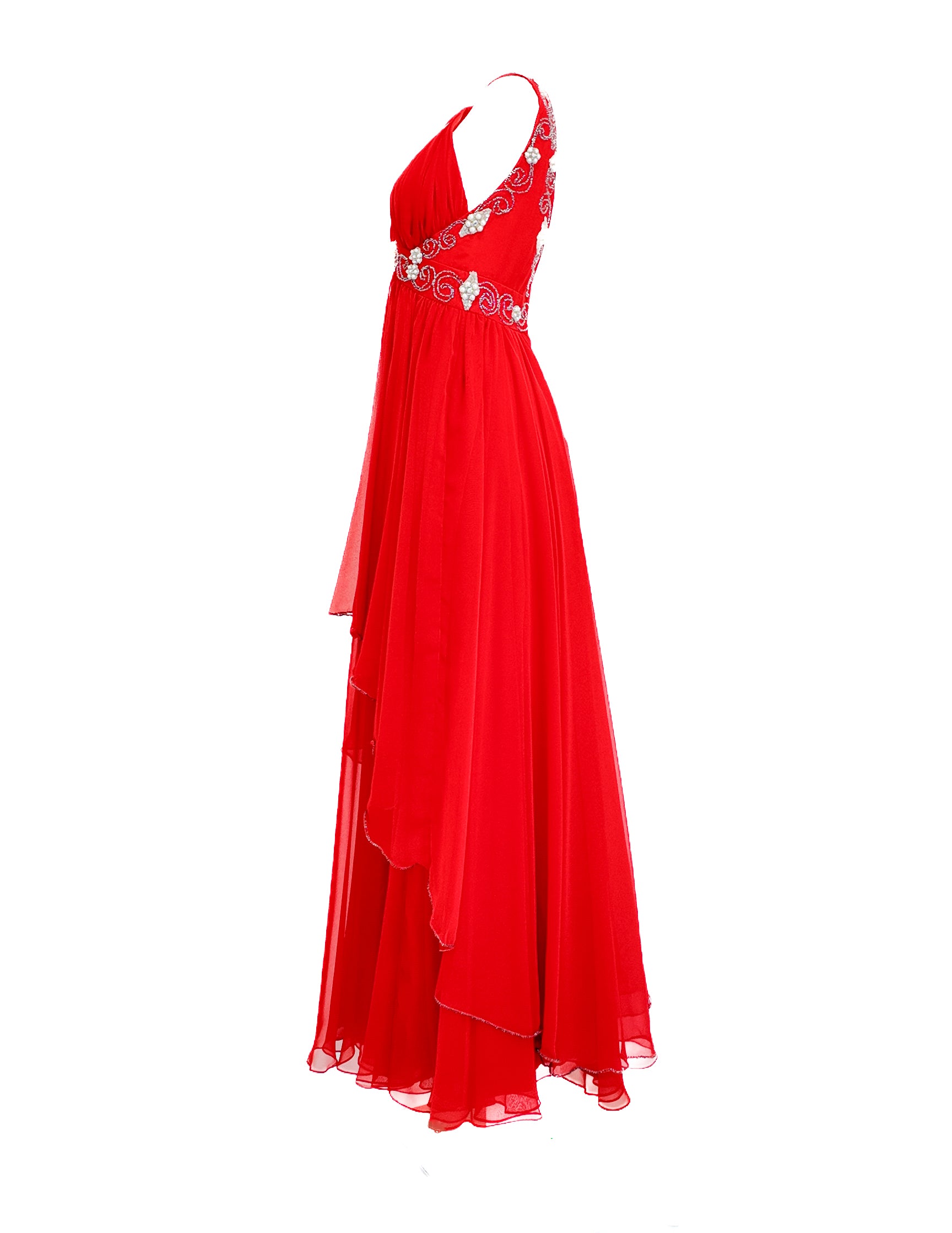 Red evening gown with floral embellishments on a white background