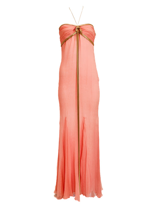 Coral strapless gown with a bow detail on a white background