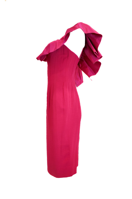 Pink one-shoulder dress with ruffled detail on a white background