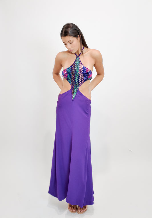Woman wearing a Reinhard Luthier purple evening dress with a colorful sequin top on a white background