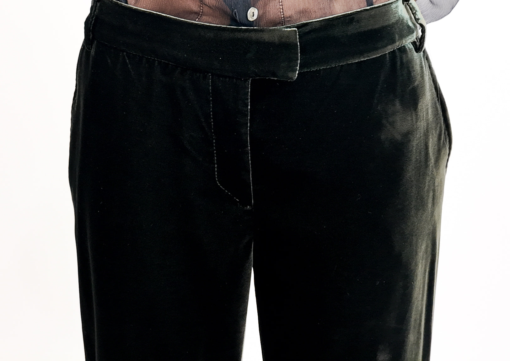 Green velvet pants on a white background