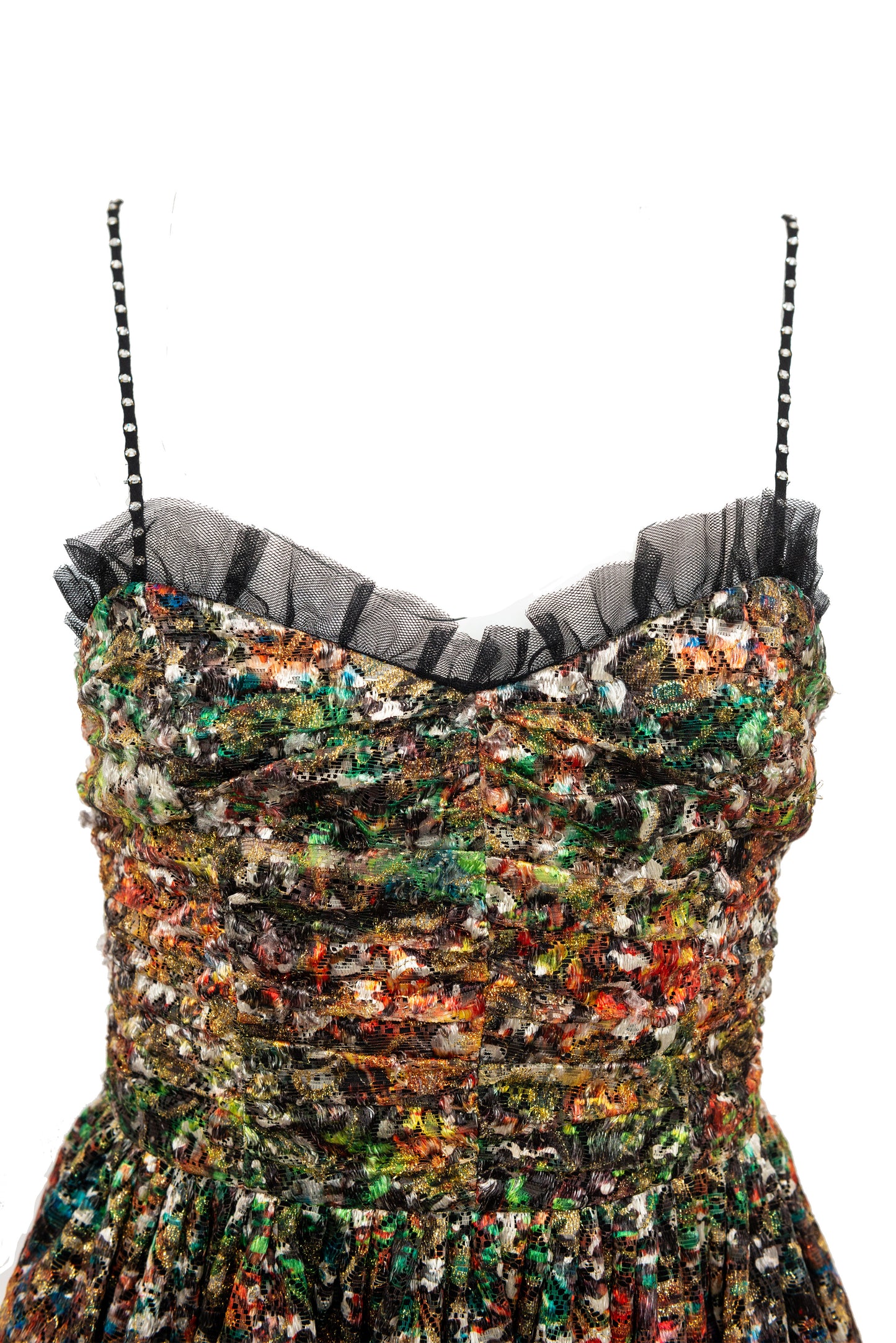 Multicolored lace dress with sheer black trim on a white background