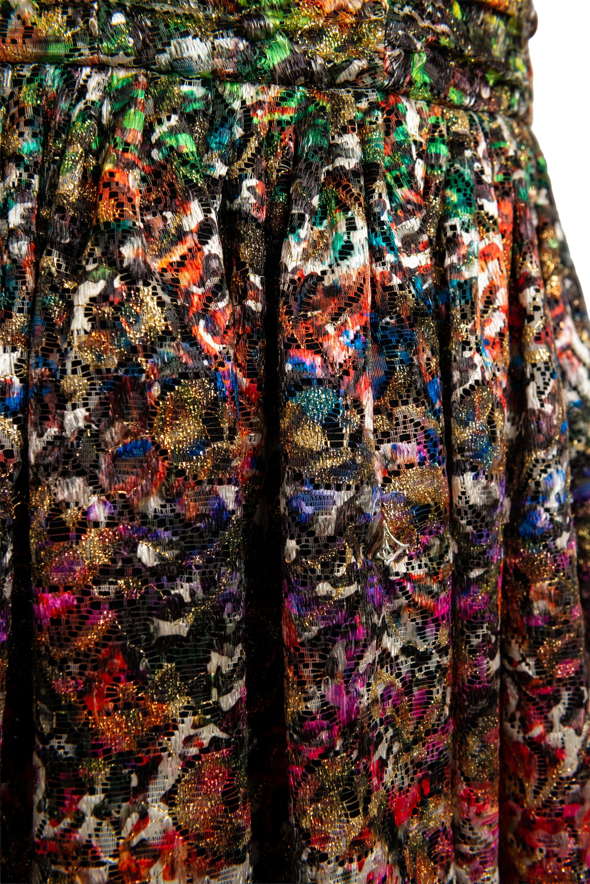 Close-up of a multicolored lace fabric with a pattern.