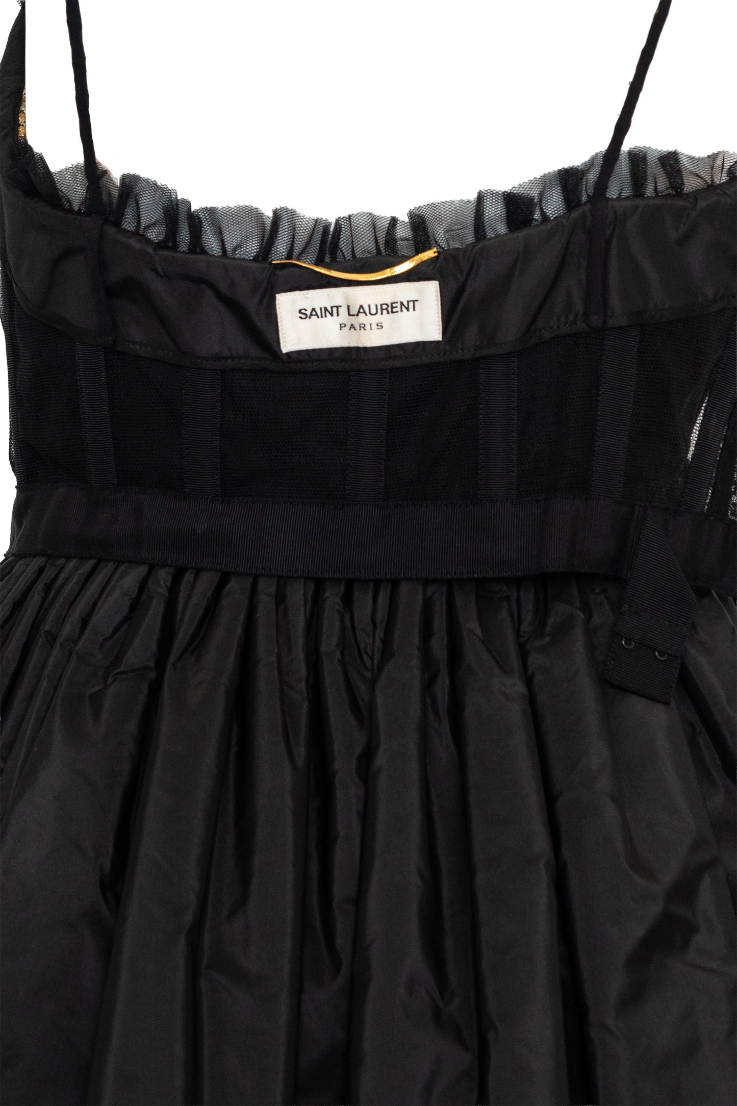 Black dress with 'Saint Laurent' label on a white background
