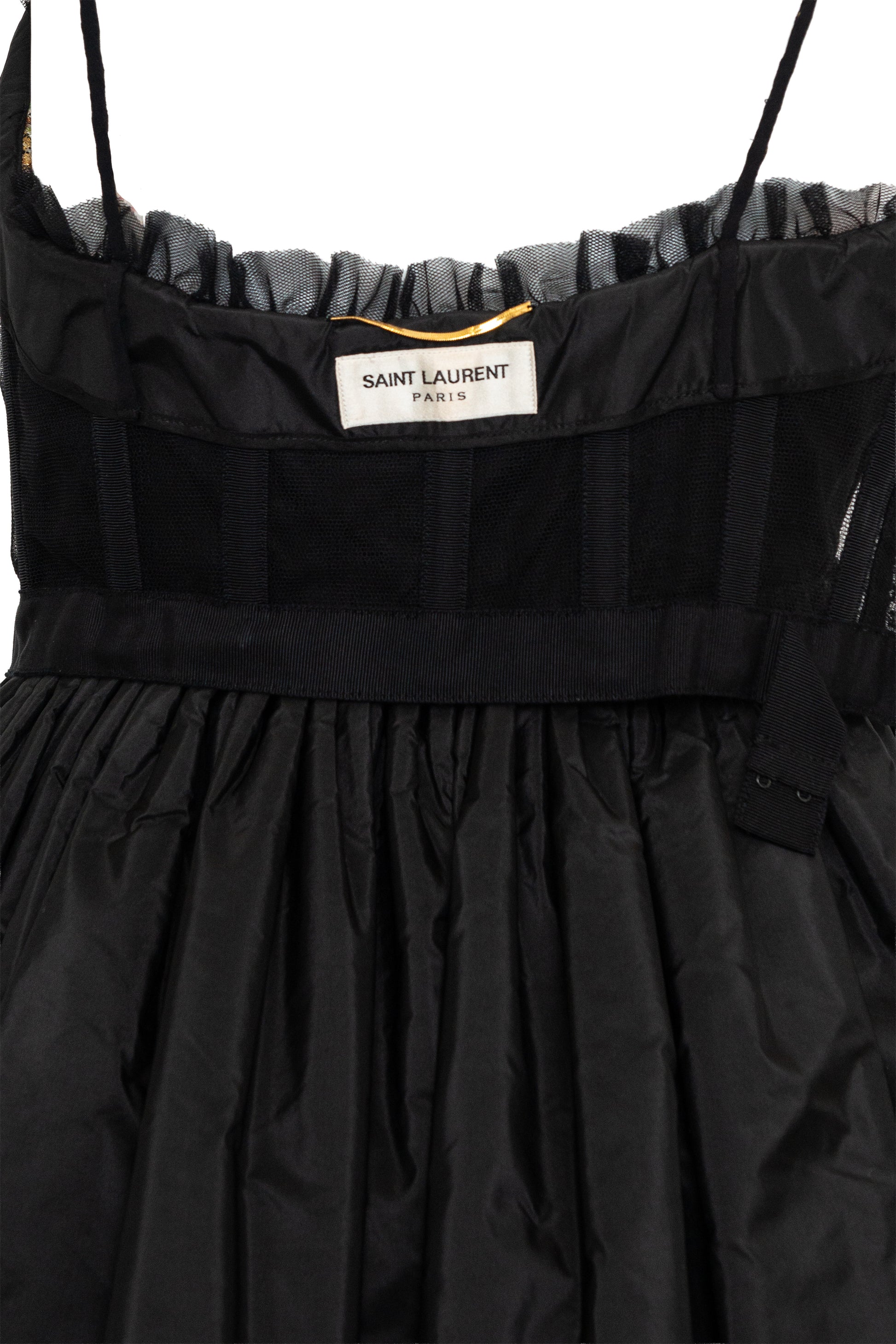 Black dress with 'Saint Laurent' label on a white background