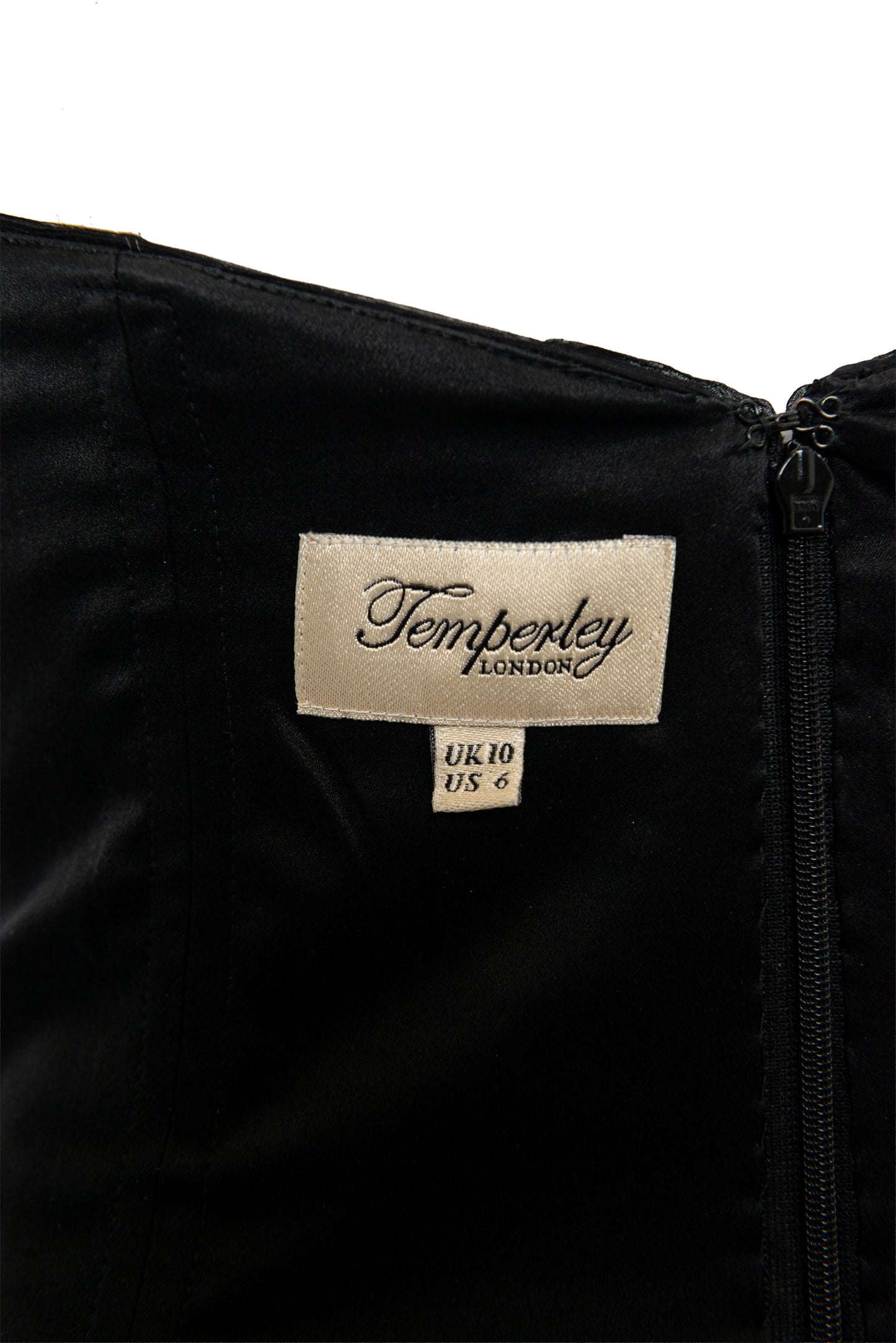 Black jacket with a Temperley London label on a white background