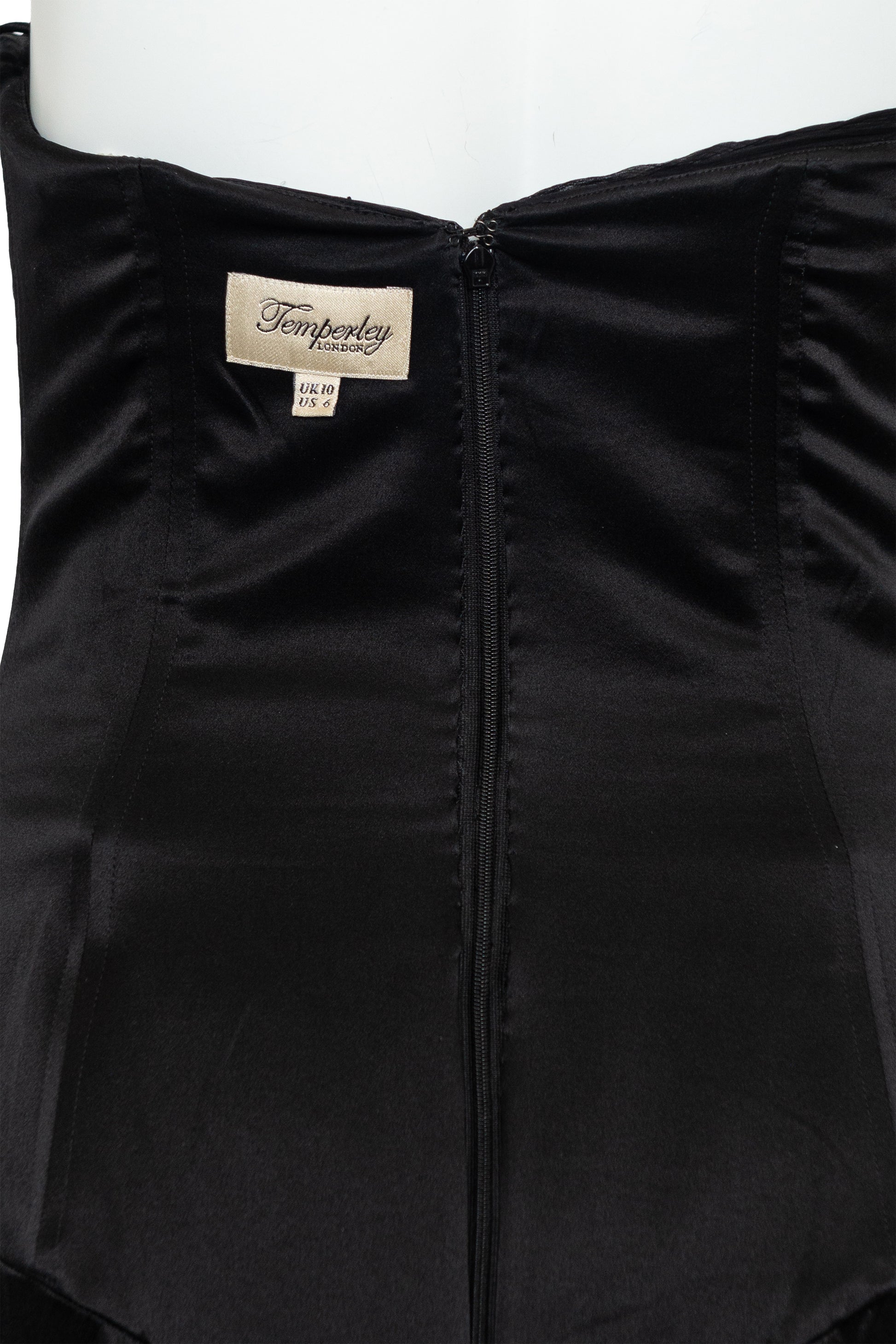 Black garment with a brand label on a white background