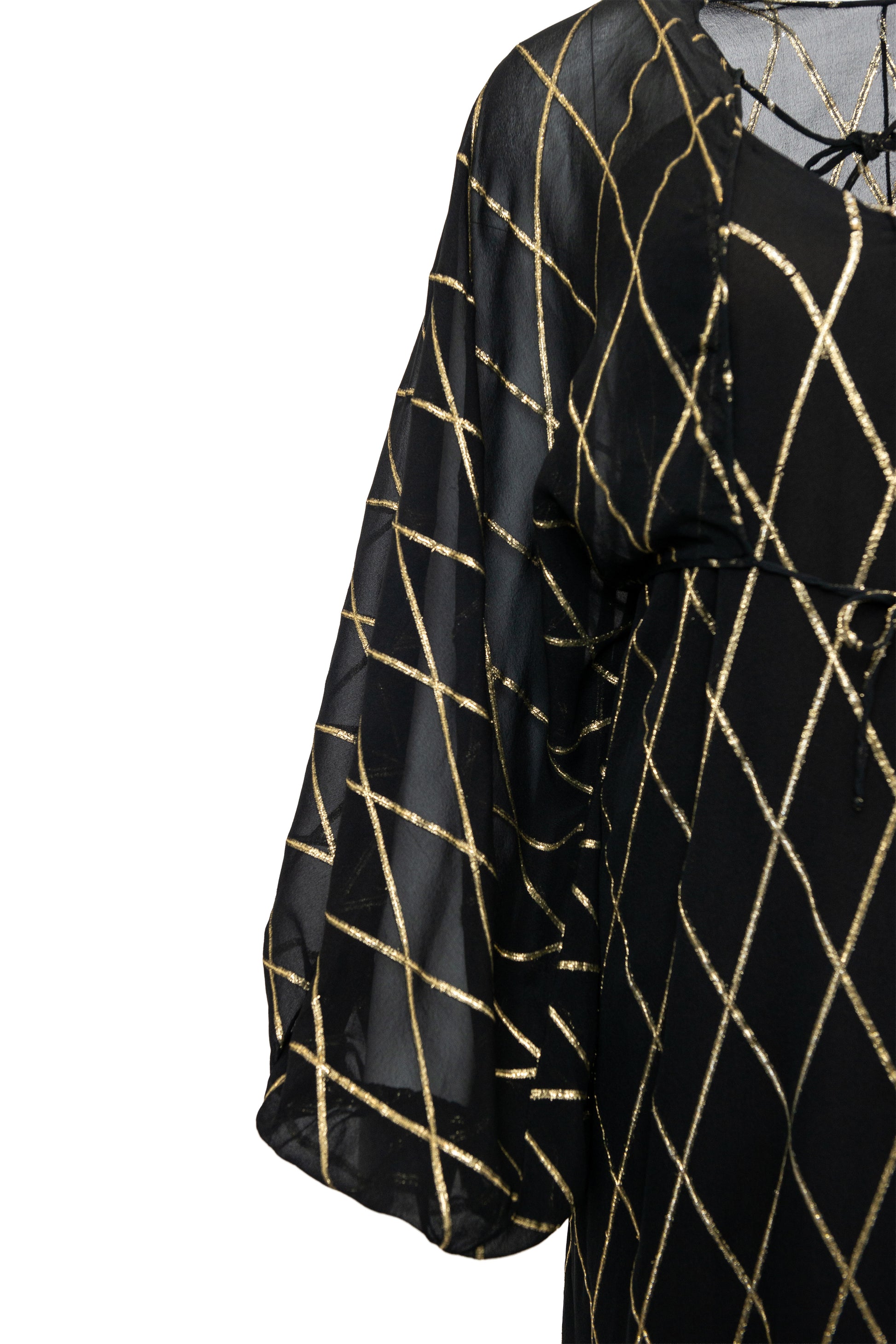 Black top with gold geometric pattern on a white background