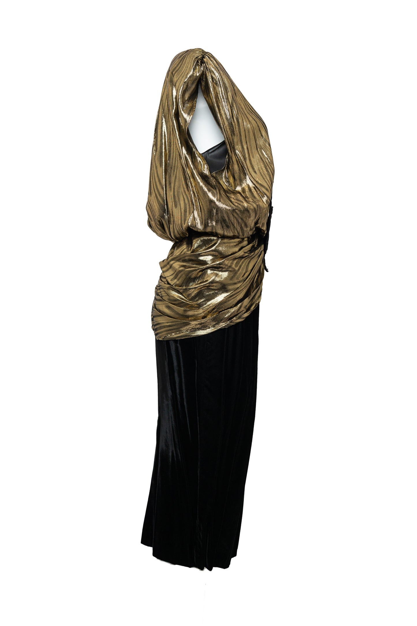 Gold and black dress with a draped gold top on a white background