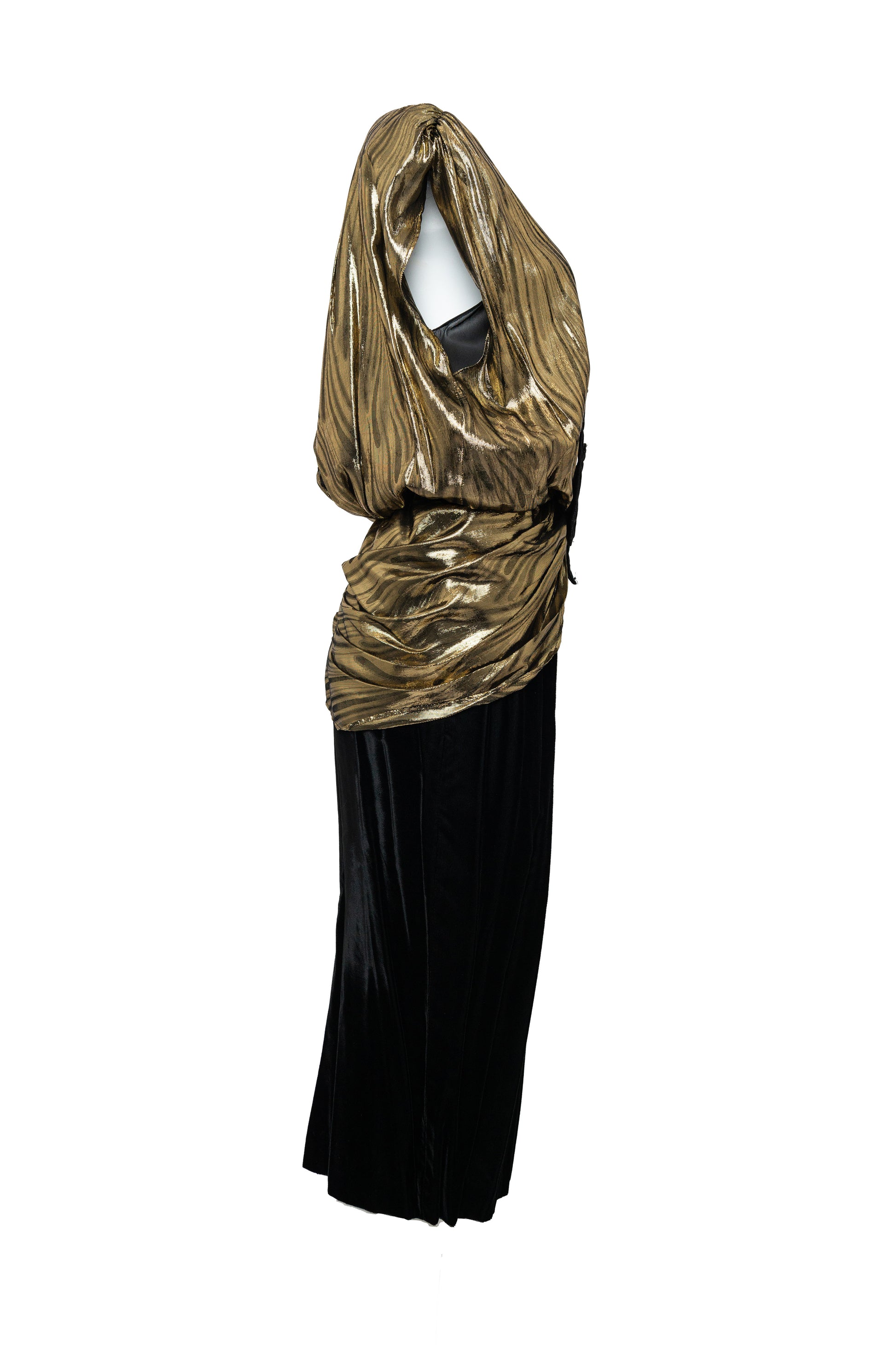 Gold and black dress with a draped gold top on a white background